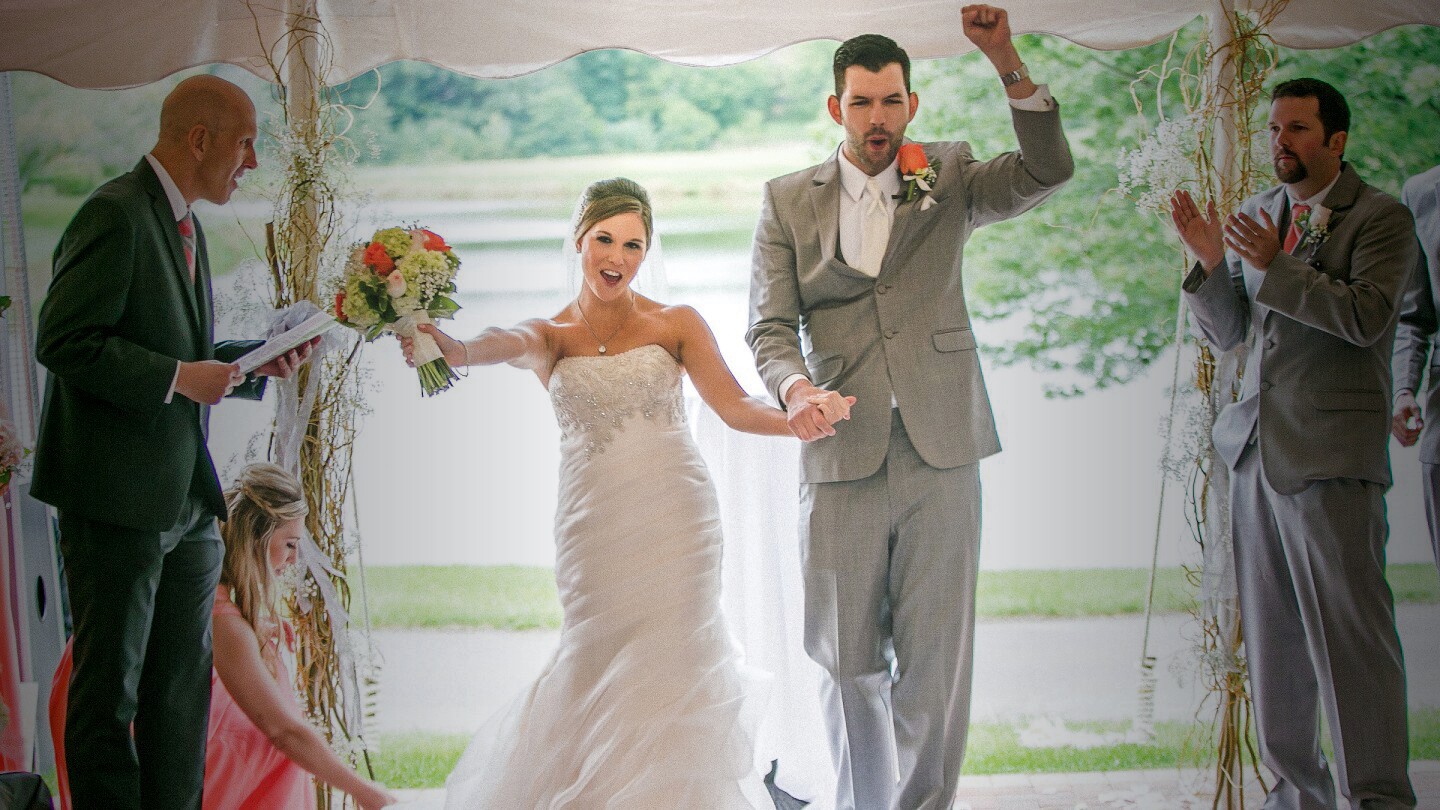 bride and groom celebrate after ceremony at wedding at Orchard Valley Golf Course