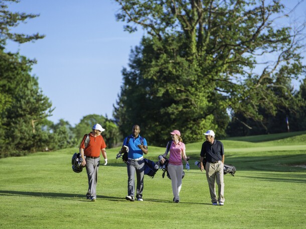 Foursome Playing Golf, Walking Golf Course