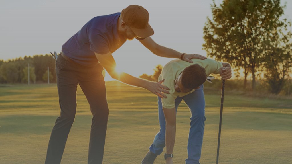 Golf instructor teaching student putting