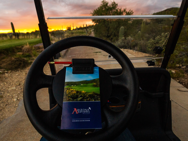 Arizona National Golf Club sunset sky view from golf cart with scorecard on wheel