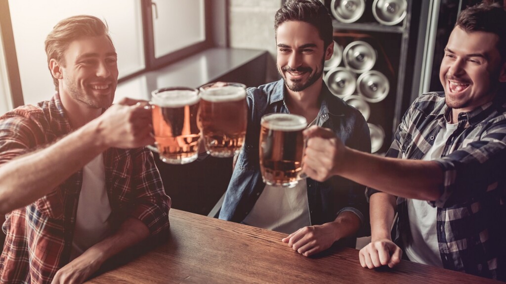 guys cheersing beers
