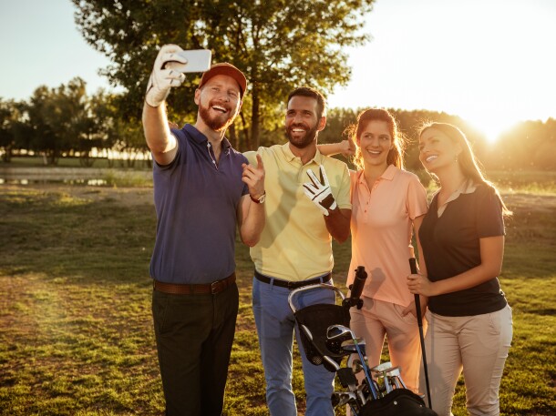 group of golfers taking a selfie