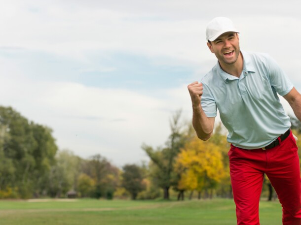 Single Male Golfer celebrating