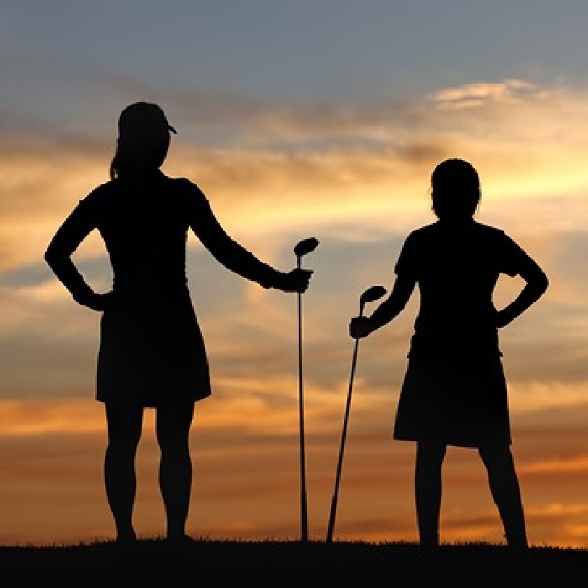 Two Women Golfers at Sunset