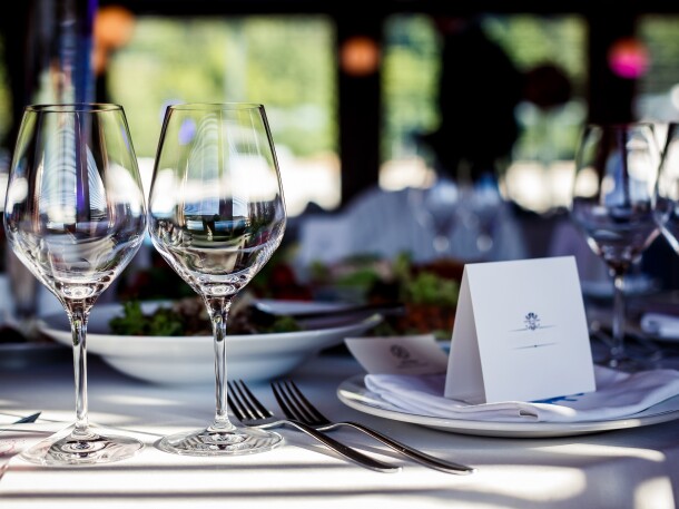 full table set yp with wine glass, food, silverware