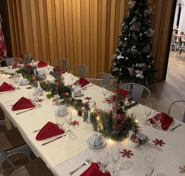 Long table set up for a holiday party at Teleli Golf Club in Sonora, CA