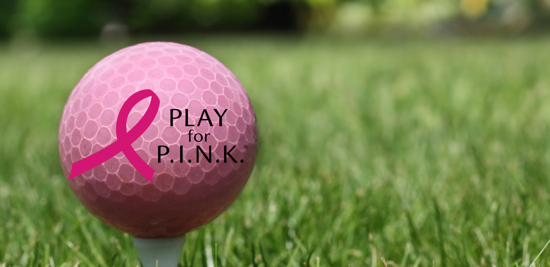 Pink golf ball with Play for P.I.N.K logo