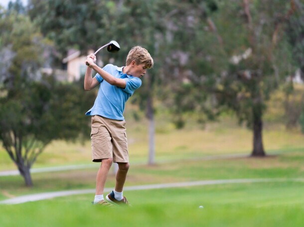 9 Year Old Boy Golfing