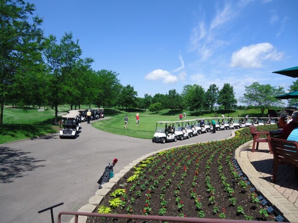 golf carts lined up for outing at orchard valley