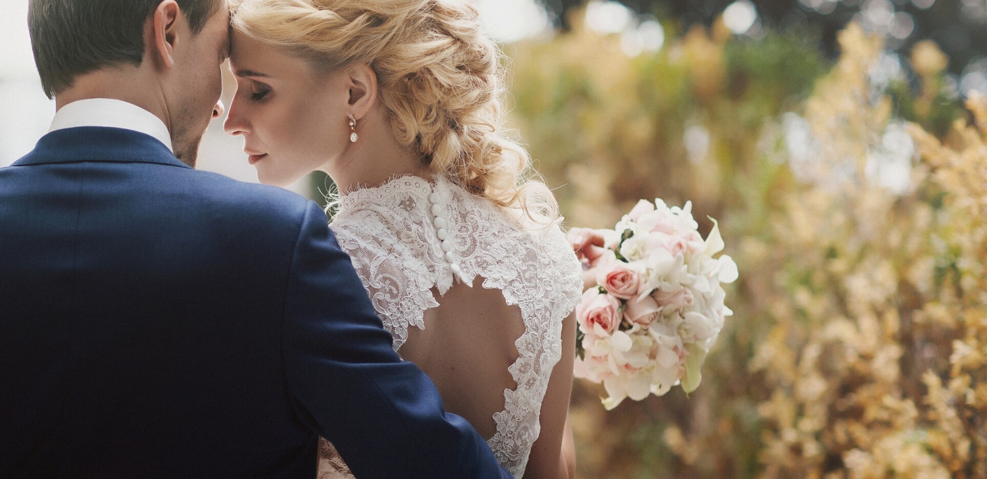 bride outside with flowers