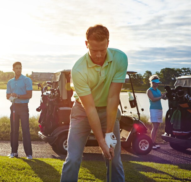foursome - two ladies and two men on golf course
