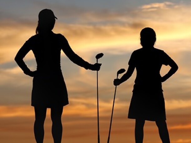 Two Women Golfers at Sunset