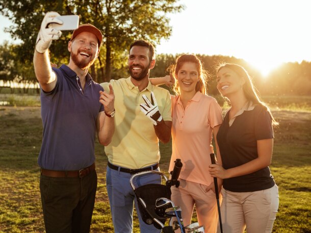Group of golfers taking a selfie at a golf outing or golf league