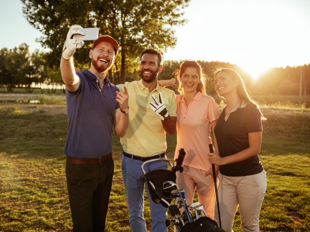 group of golfers taking a selfie