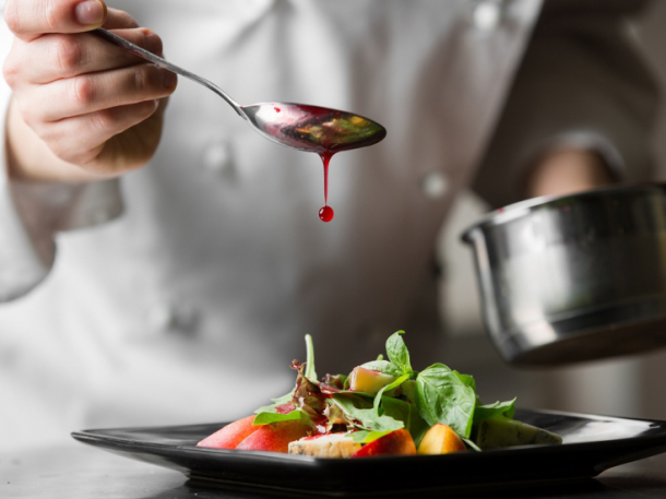 Chef preparing food dish at dining restaurant