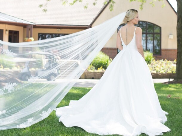 Bride with Long Veil by Clubhouse Orchard Valley Golf Course Wedding