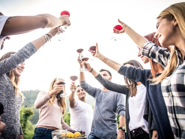 group of young adults cheersing