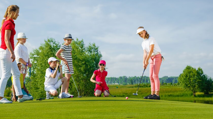 Junior Golfers Playing Golf